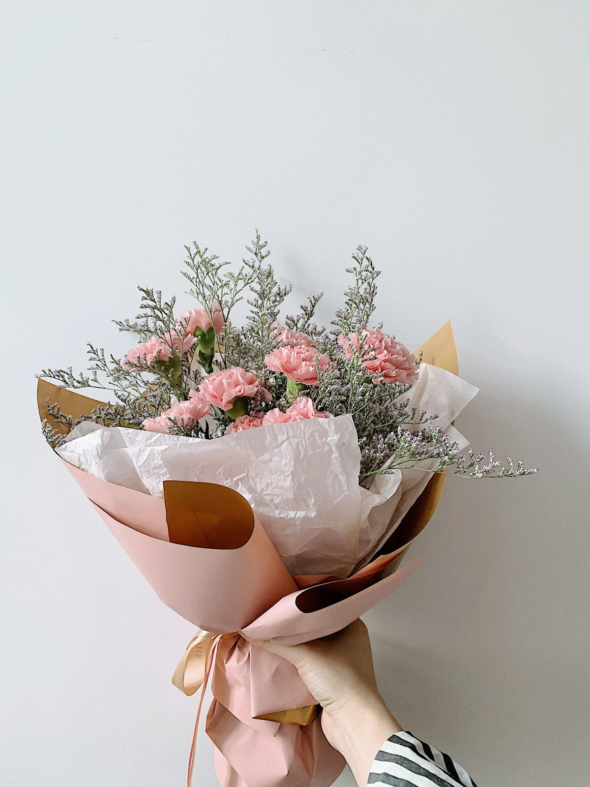 bouquet of flowers on brown wooden table