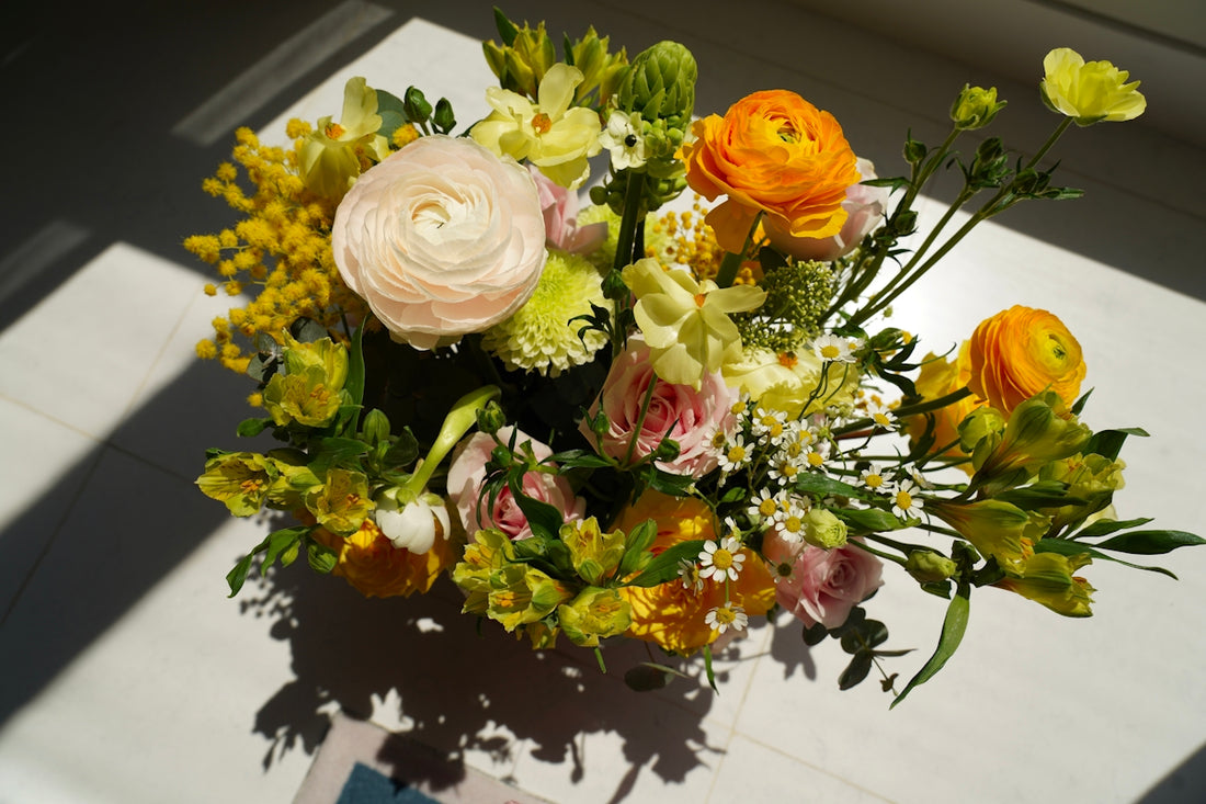 A bouquet of flowers sitting on top of a table
