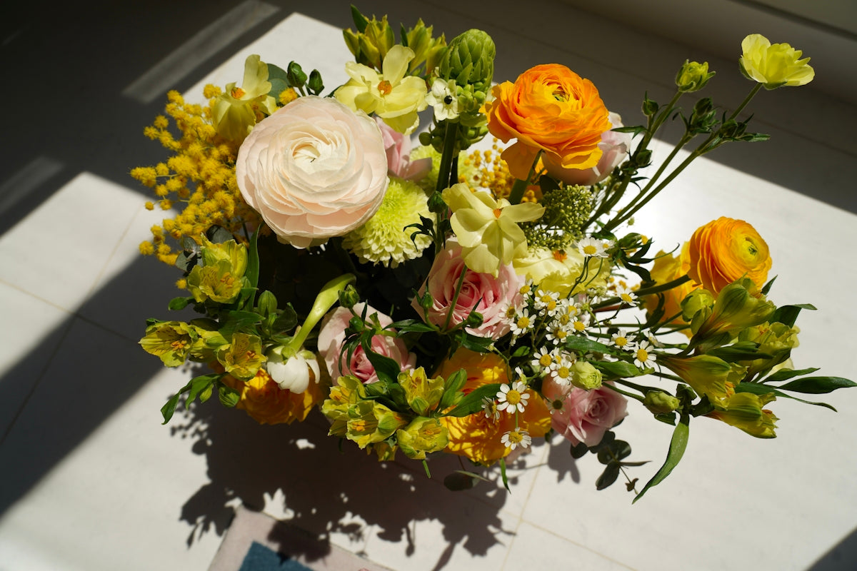 A bouquet of flowers sitting on top of a table